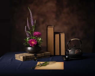 a vase with flowers on a table